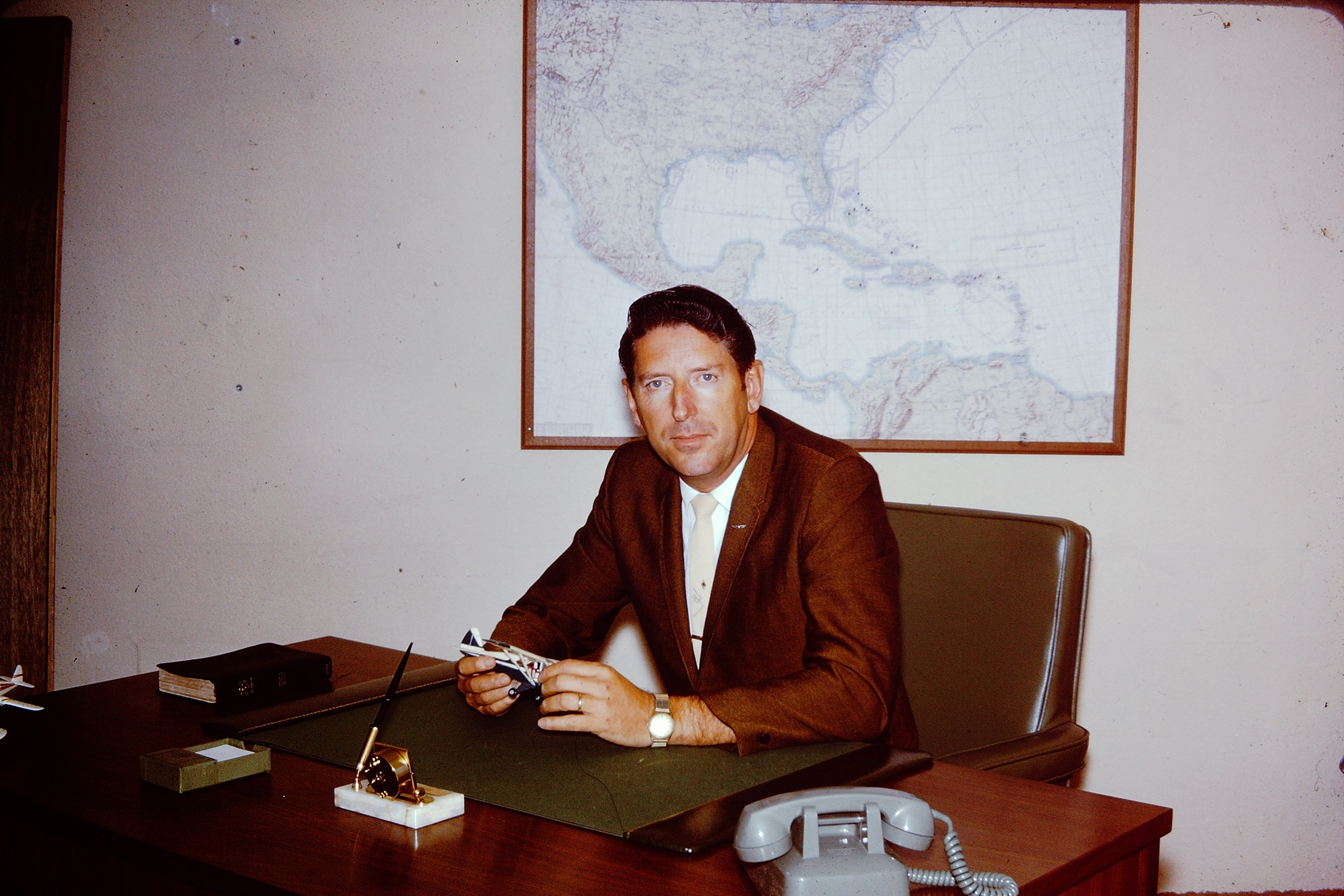 Don Beldin sitting at his desk in 1968.